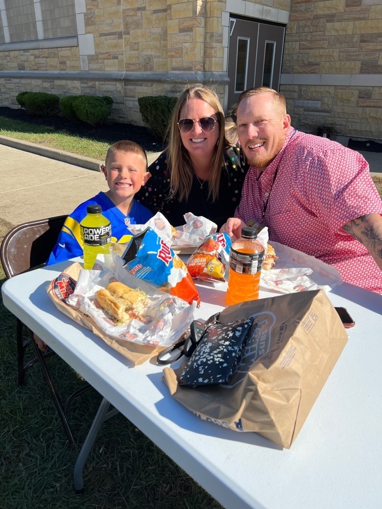 Enjoying sunshine and lunch with family.