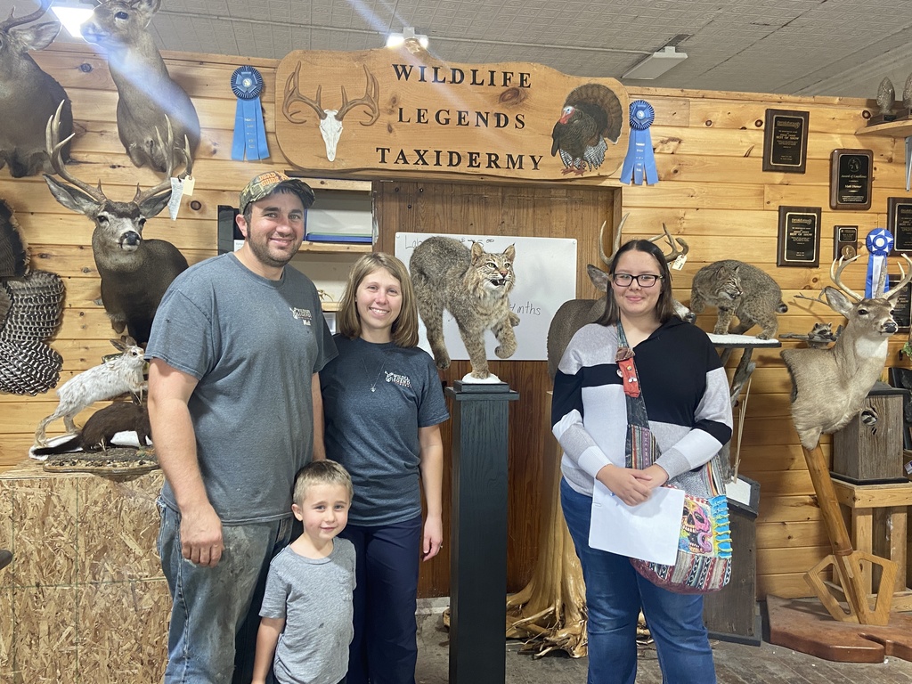 Four people at taxidermist