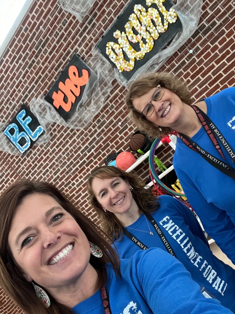 Three staff members smiling