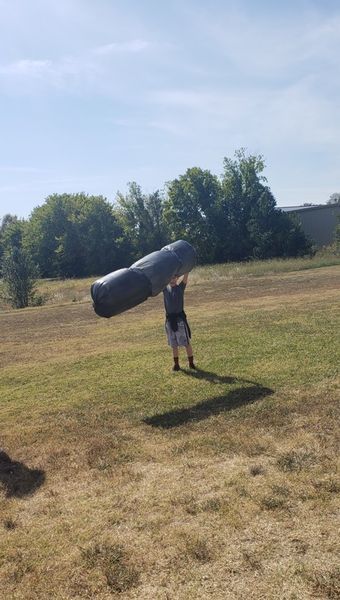 student holding solar bag 
