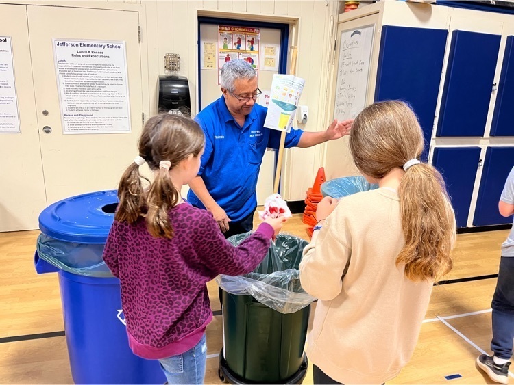 Our custodian observes as students place fold waste into the correct barrel.
