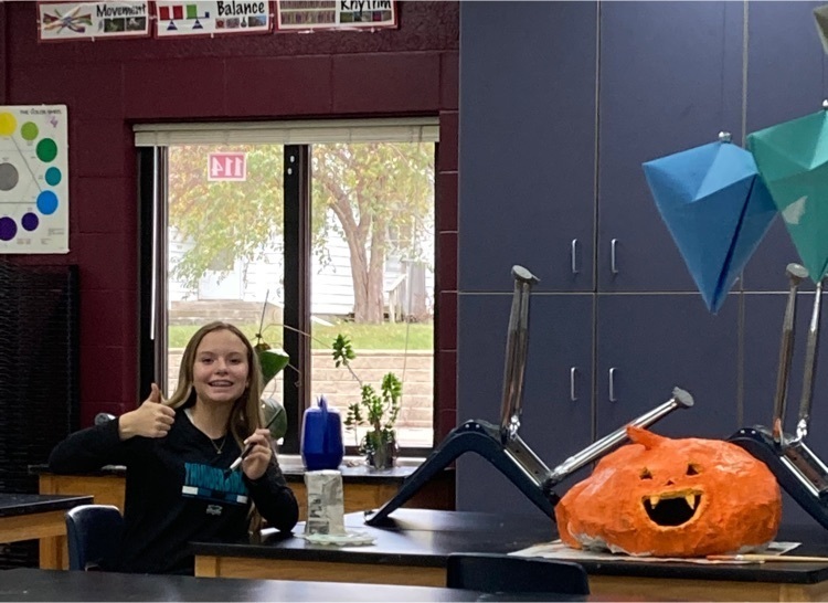 Peyton enjoying paper mache art!