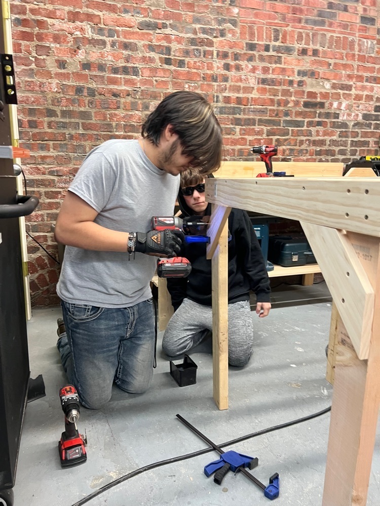 students drilling in the workshop 