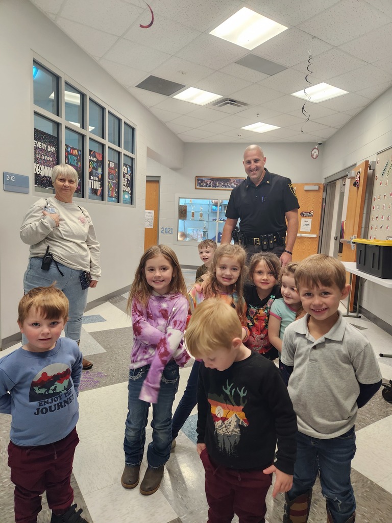 PreK students with Mrs. Theresa and police officer