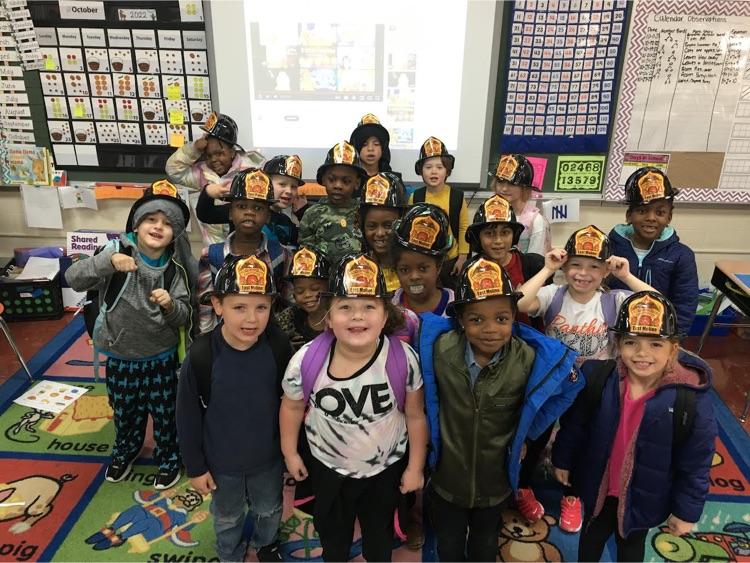 photo of kids in firefighter hats