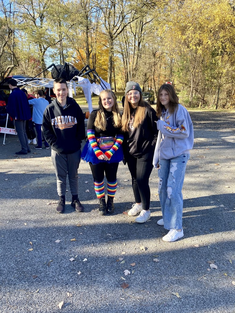 group of students pose together outside