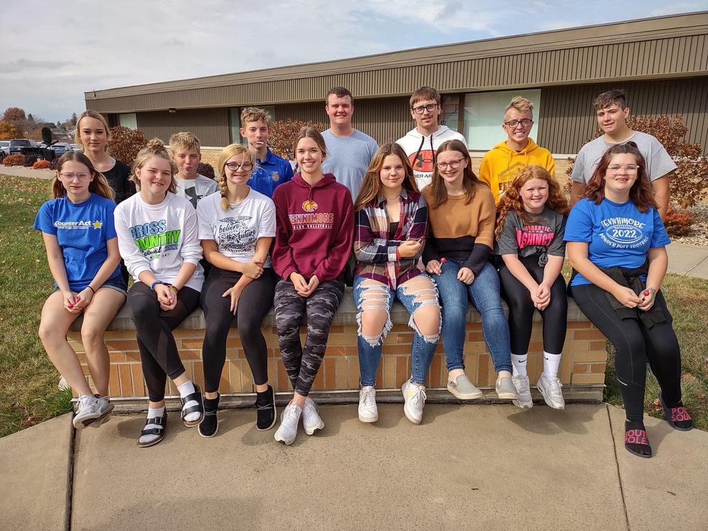 FFA students sit in rows out in front of high school