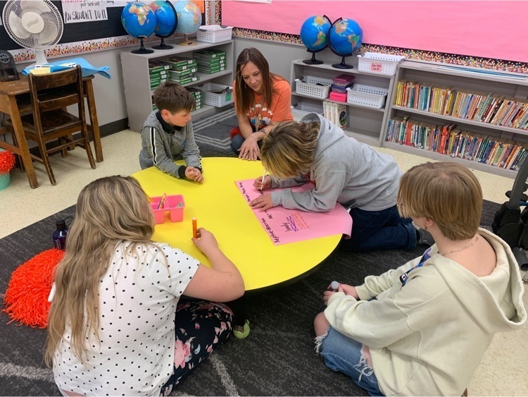 children working on a poster 