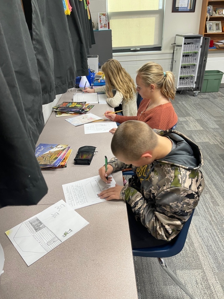5th graders, writing final copies and illustrating.