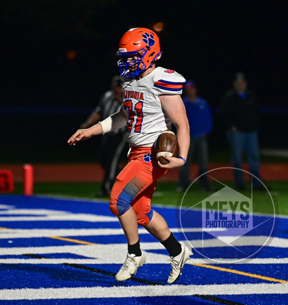 football player in endzone with ball