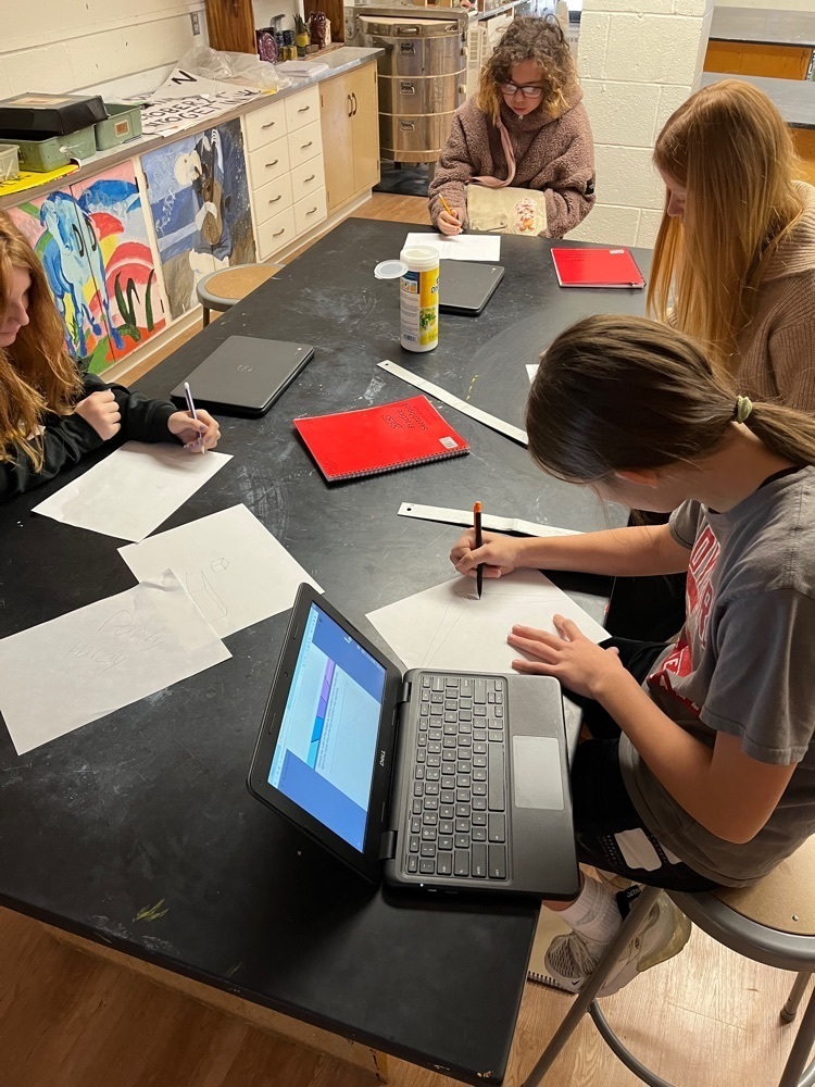 Students working on their drawings.
