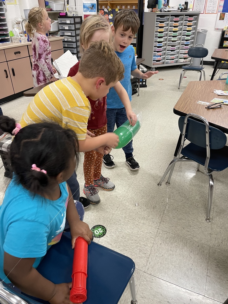 group of kids working on science project