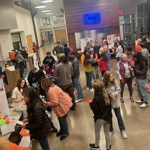 Families and community members check out the student displays