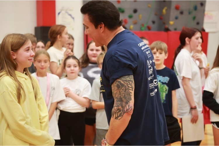 man talking to students