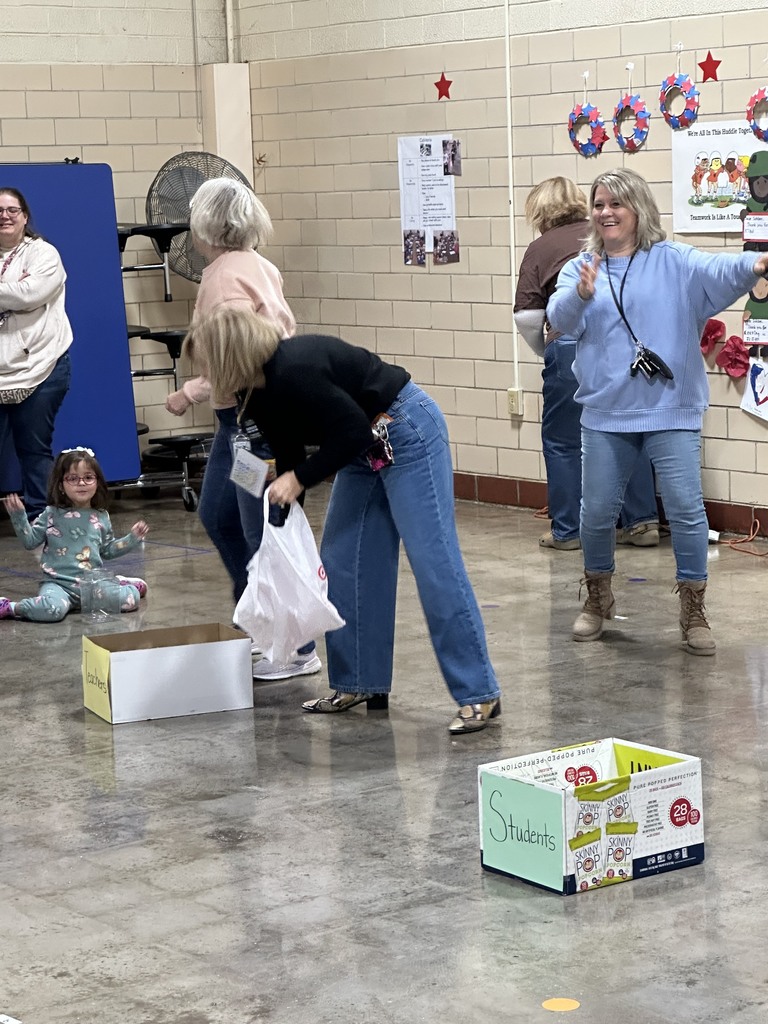 Demonstrating how to donate while Mrs. Buysse does the hula dance