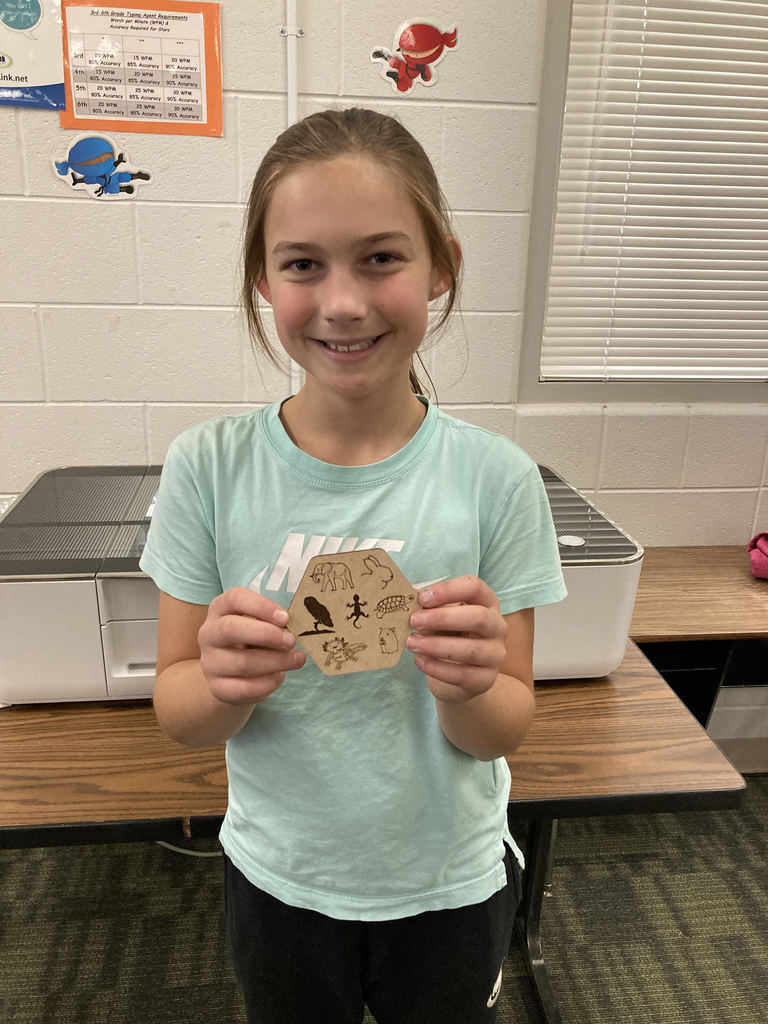 Pictured here is Lab Cats club member Callie Reed with the coaster she designed and created on the Florence Elementary Glowforge laser engraver. Awesome job Callie!!! #GoFloCats 💚💛