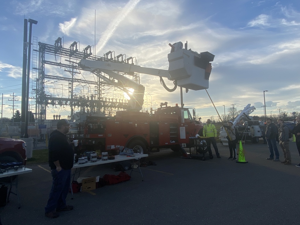 People observing cherry picker