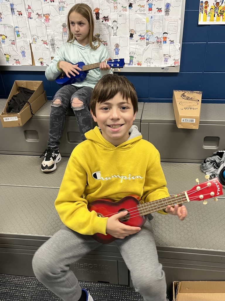 Students playing the ukulele