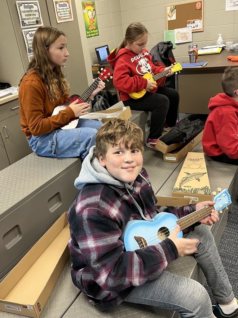 Students playing the ukulele