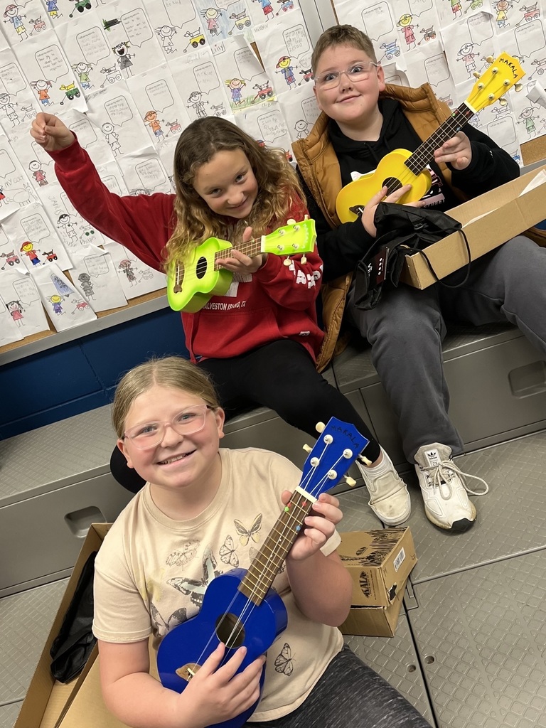 Students playing the ukulele