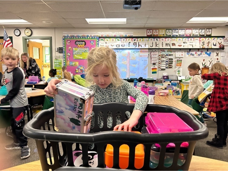 Putting away math toolboxes after a math lesson in Mrs. McDermed’s classroom  