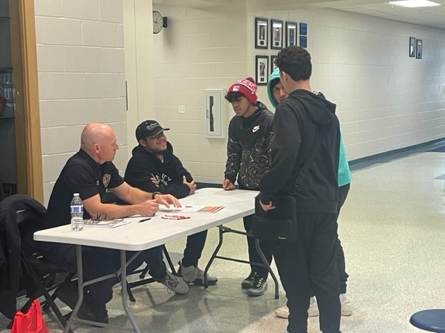 Brandon Smith talks with students about joining the fire service