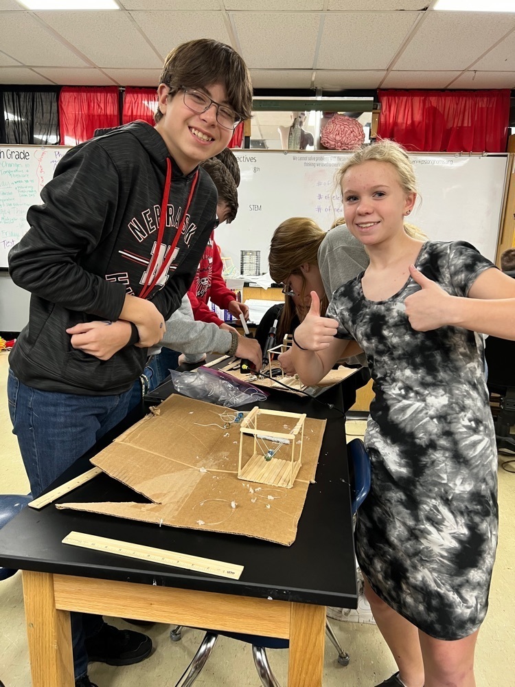 8th grade science is applying their knowledge of Newton’s 3rd Law by making their own Newton’s Cradle