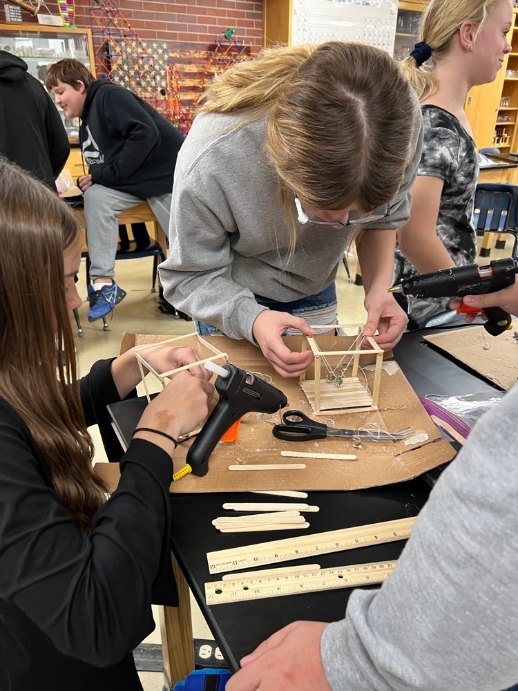 8th grade science is applying their knowledge of Newton’s 3rd Law by making their own Newton’s Cradle.