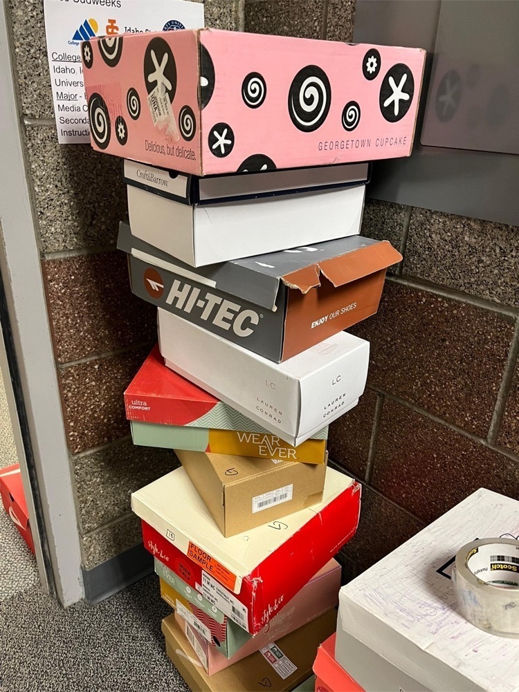 the stack of shoeboxes are getting high