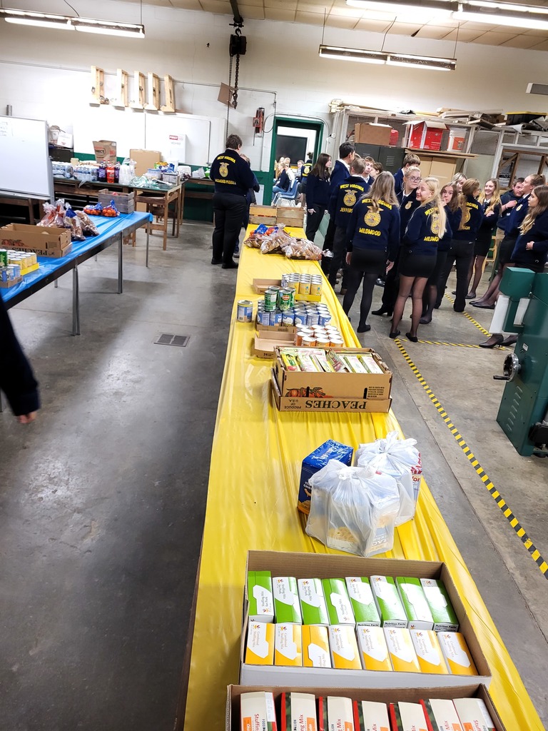 Tables of Food ready to be boxed