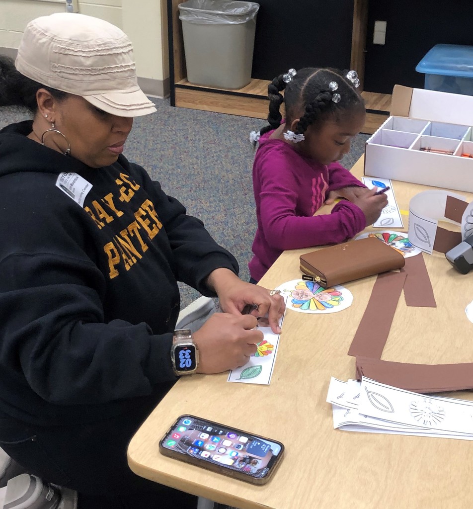 Parent and child making a picture
