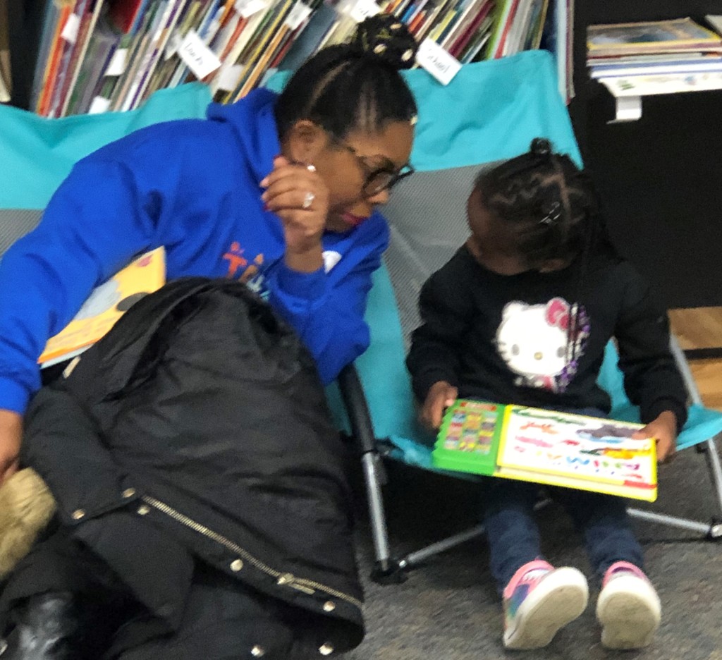 Parent and child reading a book