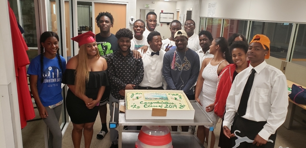 Graduates with their class cake