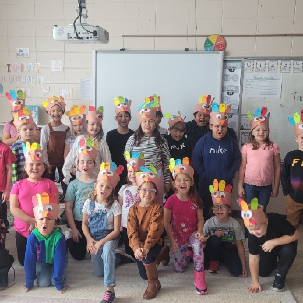 Kids wearing turkey hats