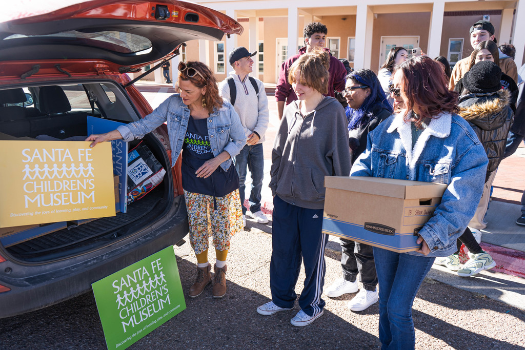 Students unloading items to create gifts