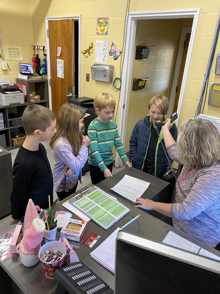 McClelland students helping Mrs. Wolfort with morning announcements