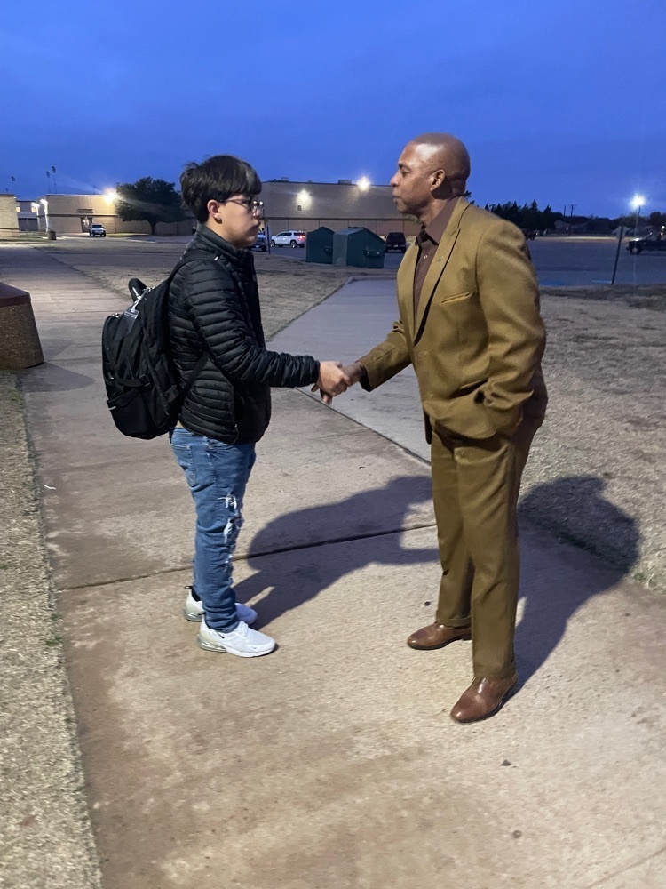 Dr. Ward greets student