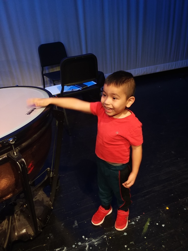 Child playing a drum