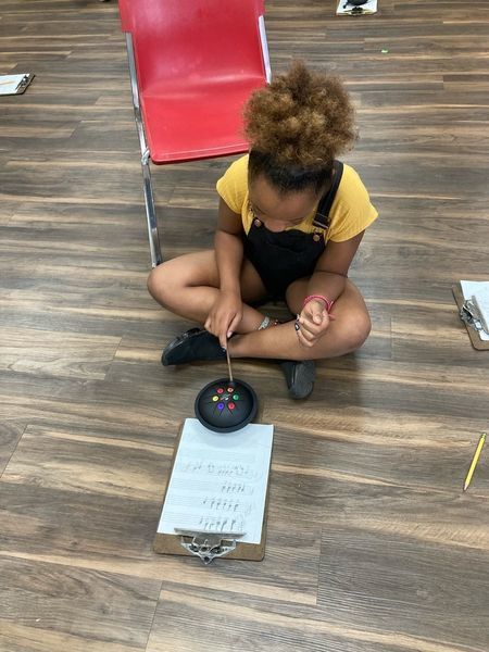 student in music class