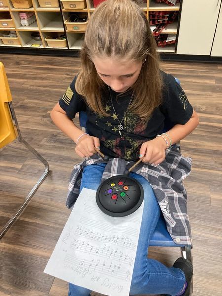 student in music class