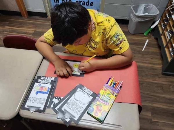 student working on reading project