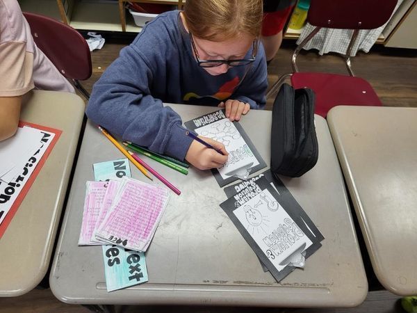 student working on reading project