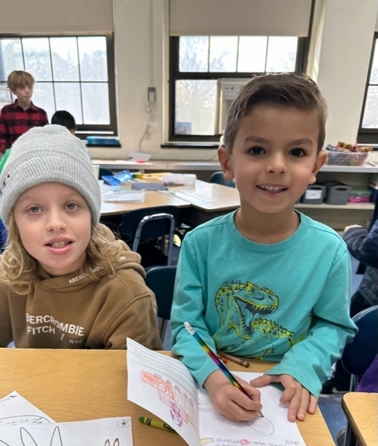 Two Wilson boys making cards for troops