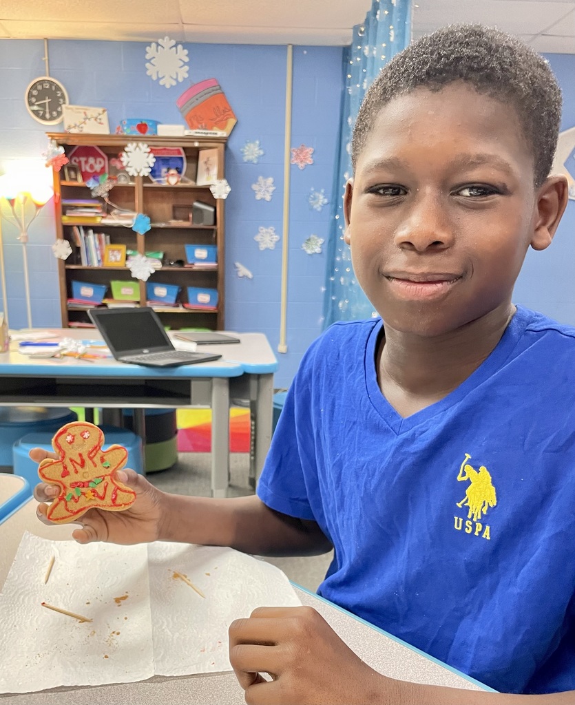 Student with gingerbread cookie