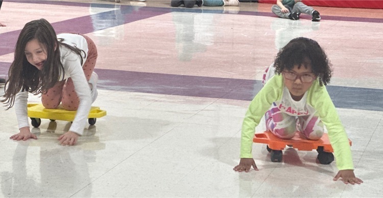 students participating in scooter relays