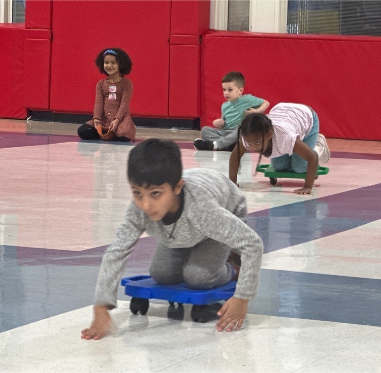 students participating in scooter relays