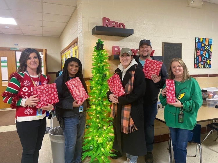 photo of teachers holding gifts