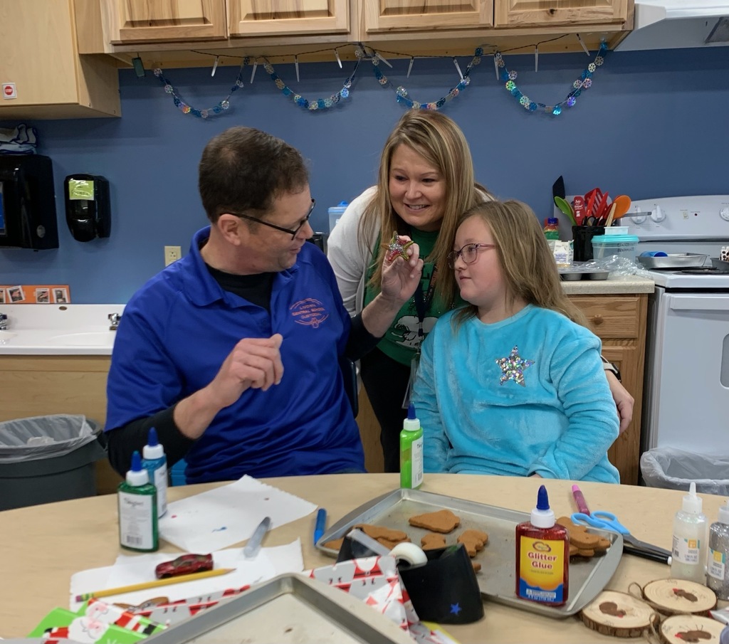 student with two adults