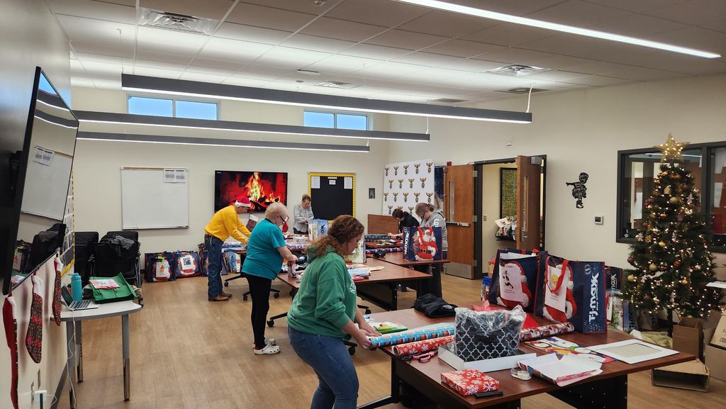 Community members wrapping presents