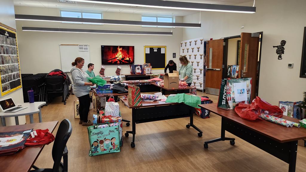 Community members wrapping presents